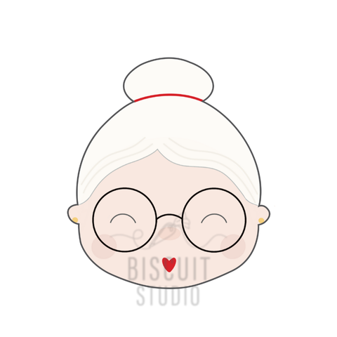 Cartoon cute design of Mrs. Claus with white hair, glasses, and a red heart on a white background with Biscuit Studio logo.