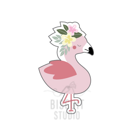 A cookie cutter in the shape of a pink flamingo with a floral design on its head by Biscuit Studio.