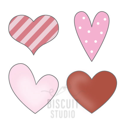 A set of four mini heart-shaped cookie cutters in different colors including red, pink, white with black dots, and red by Biscuit Studio