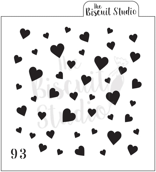 Stencil with scattered black heart shapes on white background, perfect for cookie decorating.